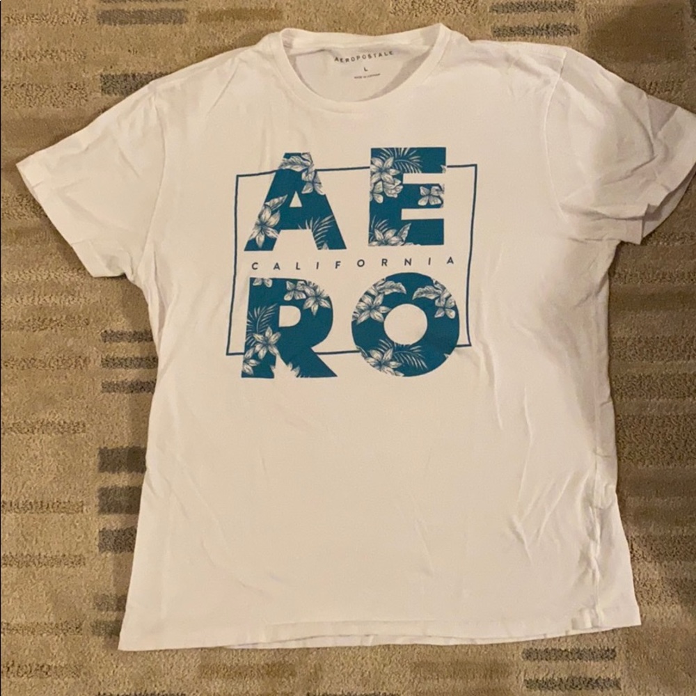 White and teal colored shirt